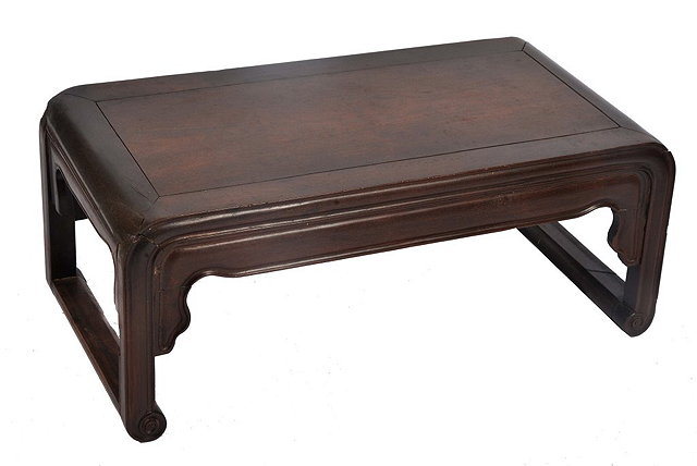 Appraisal: A CHINESE HARDWOOD OPIUM TABLE having a rectangular top circa