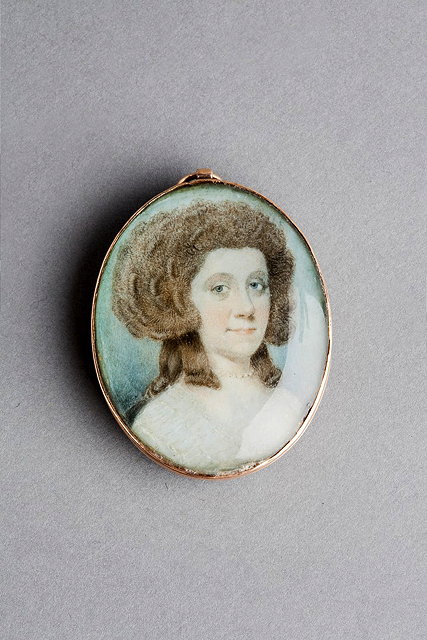 Appraisal: A GOLD MOUNTED PENDANT with inset miniature of the head