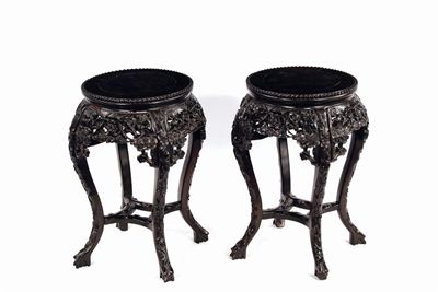 Appraisal: A pair of Chinese hardwood low stands each with a