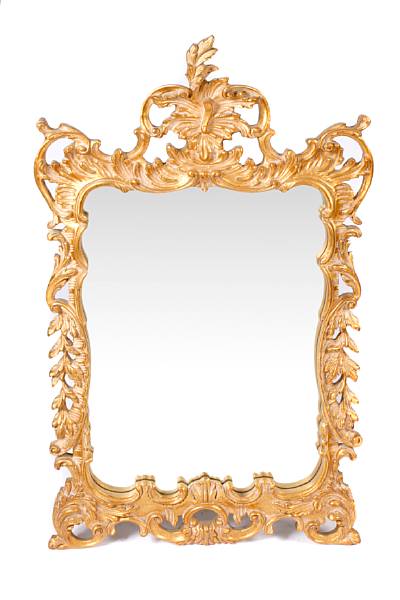 Appraisal: A Rococo style giltwood mirror height in width in