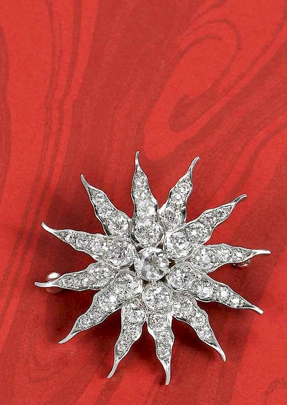 Appraisal: kt ct Diamond Starburst Brooch and pendant hinged bail center