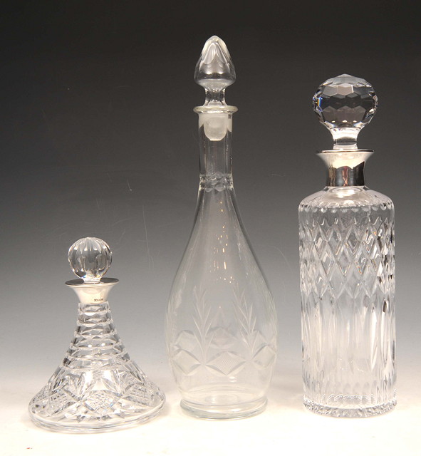 Appraisal: A SILVER MOUNTED SHIPS DECANTER with star base high another