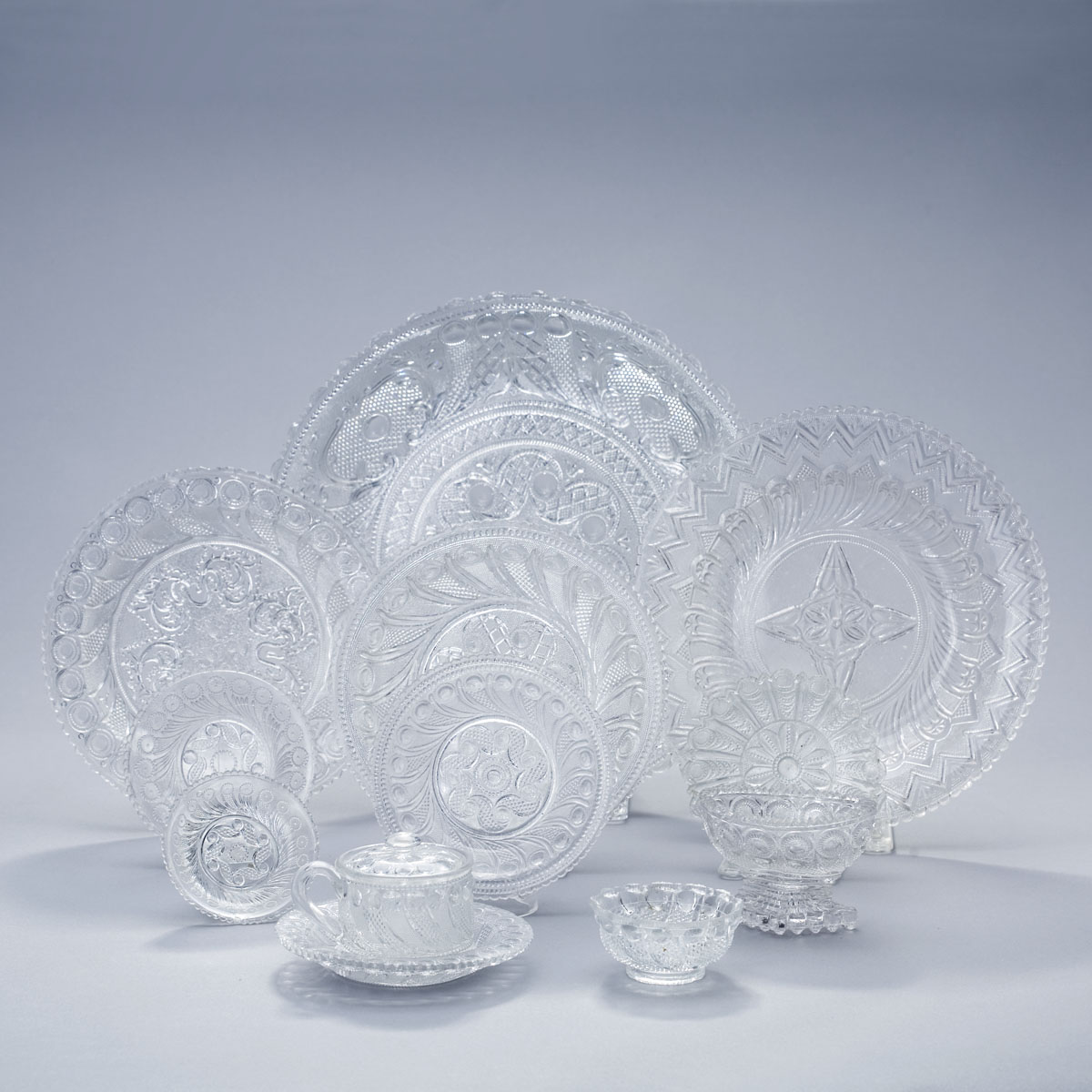 Appraisal: GROUP OF LACY PRESSED COLORLESS GLASS TABLEWARES BOSTON SANDWICH GLASS