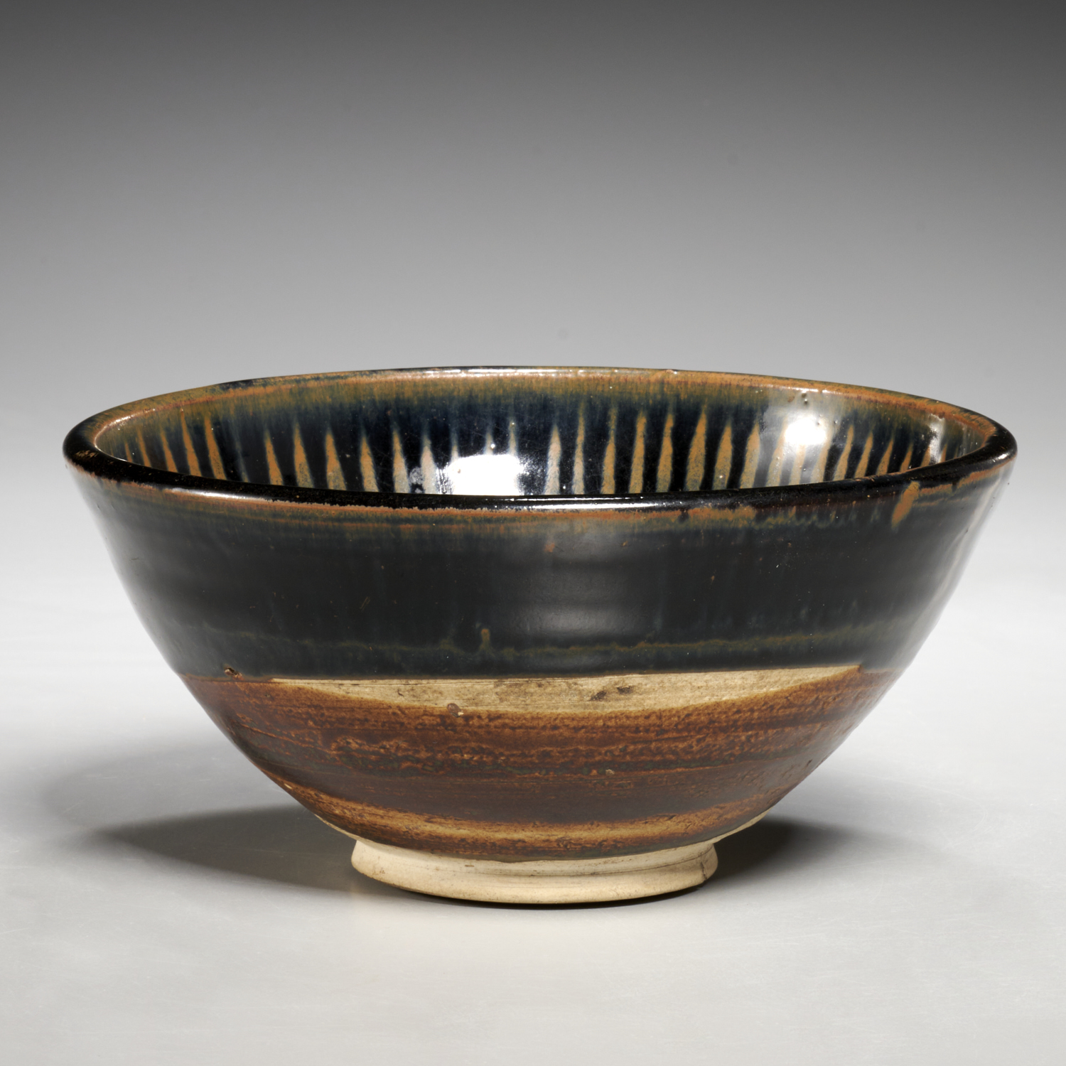 Appraisal: YUAN STYLE BLACK-GLAZED RUSSET-PAINTED BOWL Likely of the period -