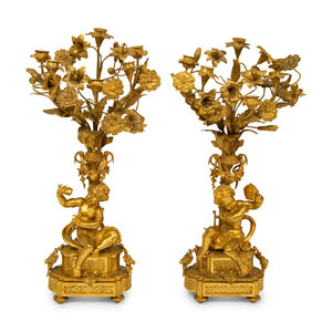 Appraisal: A Pair of Louis XV Style Six-Light Gilt Bronze Figural