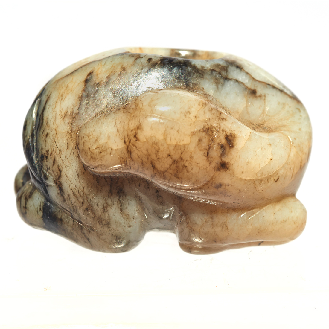 Appraisal: CHINESE MOTTLED JADE CAMEL Chinese mottled jade camel the recumbent