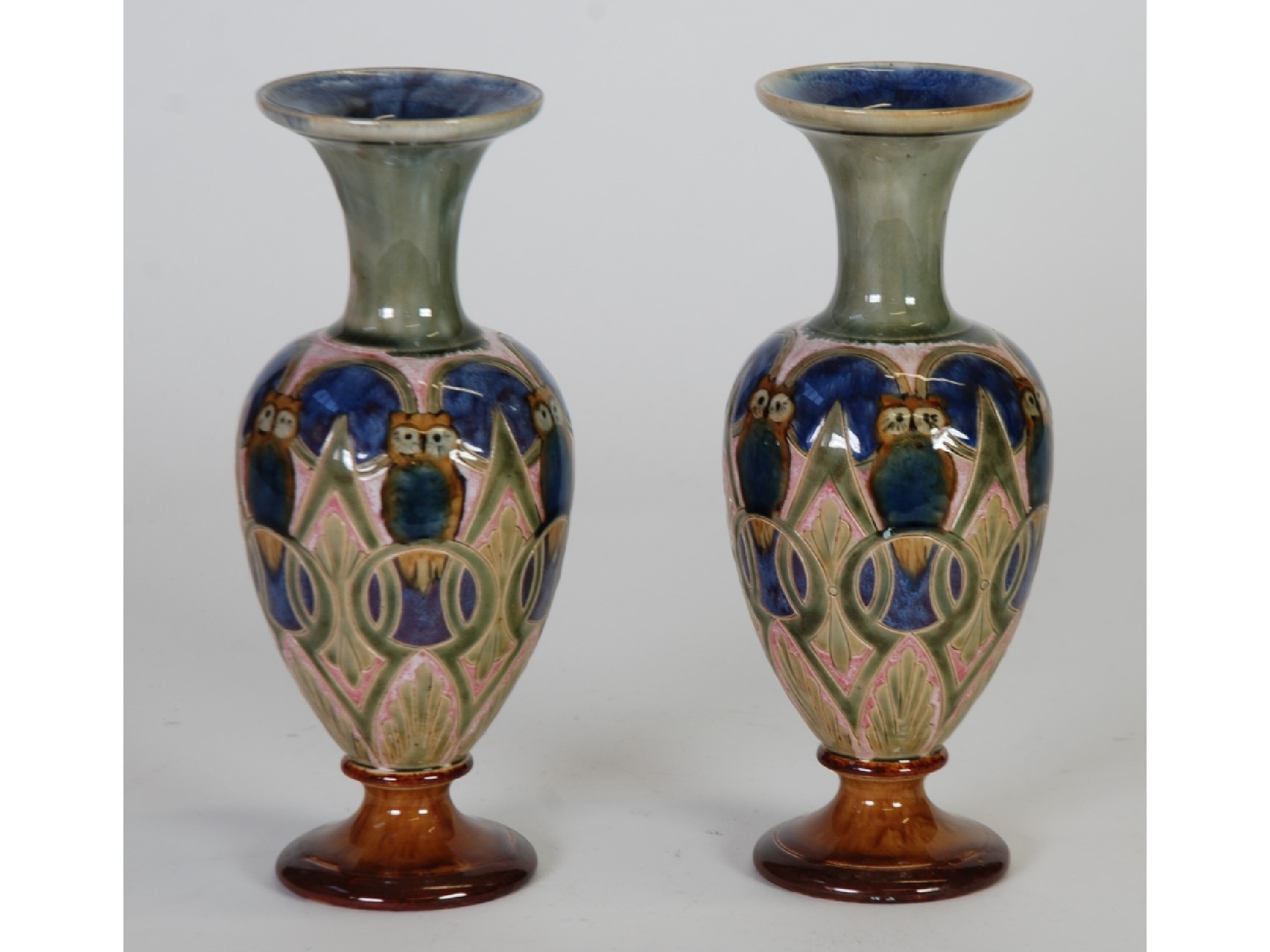 Appraisal: PAIR OF ROYAL DOULTON POTTERY PEDESTAL VASES BY ELIZA SIMMANCE