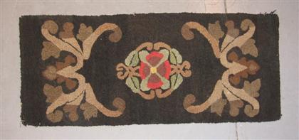 Appraisal: Hooked rug late th century Rectangular for with central floral