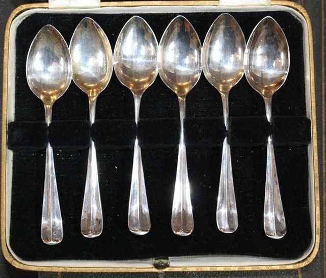 Appraisal: A CASED SET OF SIX SILVER TEASPOONS with bright cut