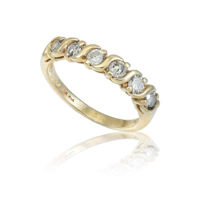 Appraisal: DIAMOND WEDDING OR ANNIVERSARY BAND RING K yellow gold band