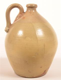 Appraisal: Glazed Earthenware Jug Raised spout applied handle bulbous body -