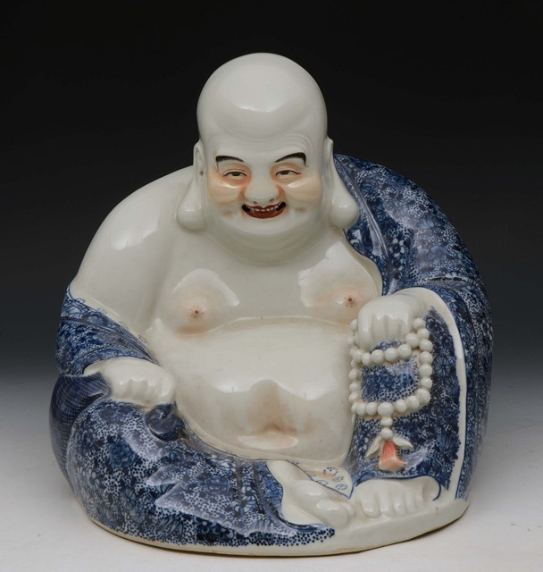 Appraisal: A CHINESE POLYCHROME PORCELAIN SMILING BUDDHA holding a Mandarin necklace