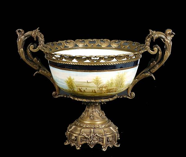 Appraisal: A Sevres style bronze mounted porcelain center bowl height in