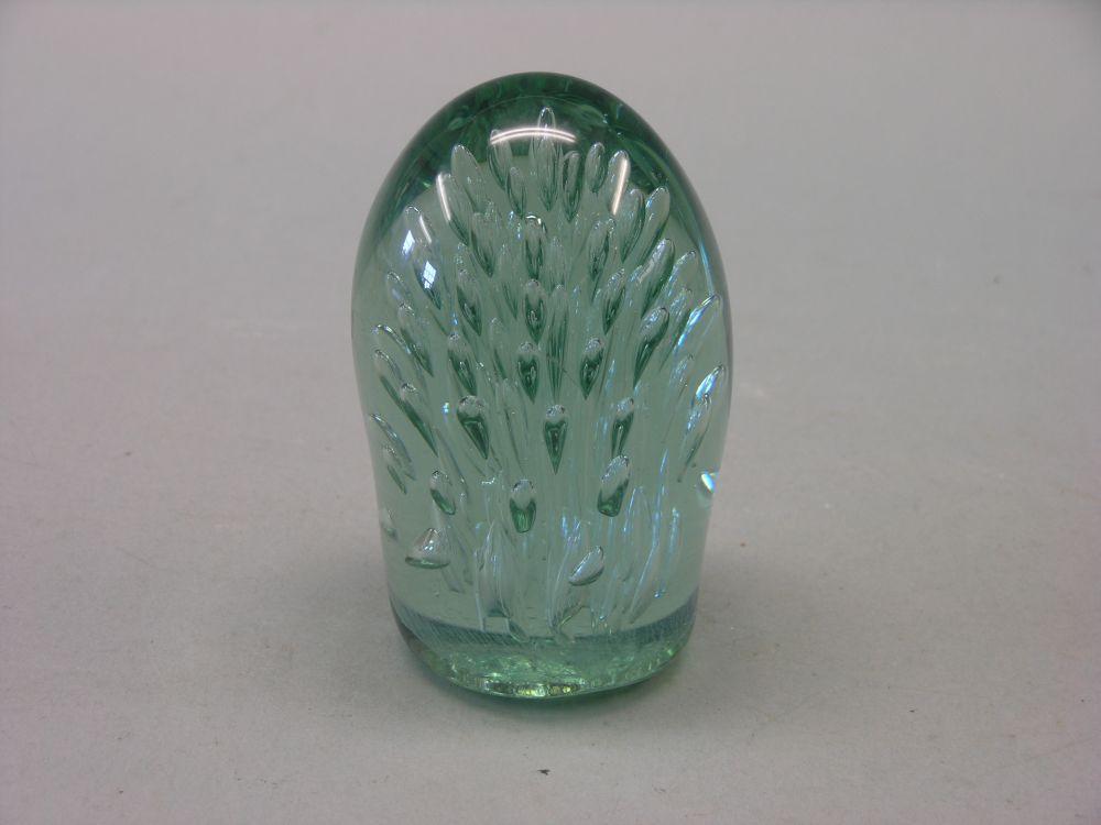 Appraisal: A Victorian green glass dump doorstop with inset air tears