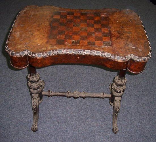 Appraisal: A Victorian walnut side table the shaped rectangular top fitted