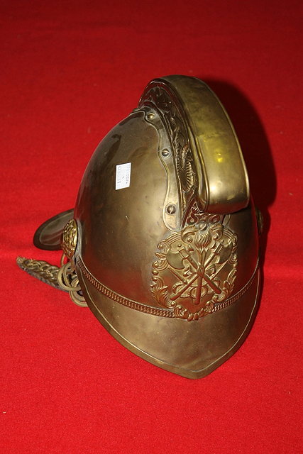 Appraisal: A LATE VICTORIAN EMBOSSED BRASS FIREMAN'S HELMET