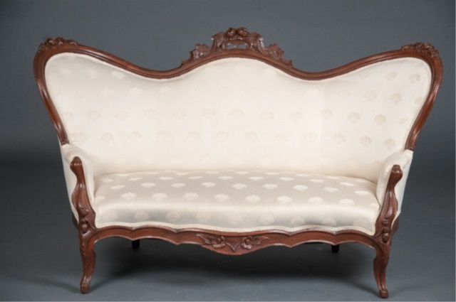 Appraisal: Victorian Walnut Settee Floral carved crest rail with white upholstery