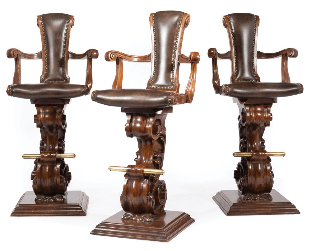 Appraisal: Three Italian-Style Carved Oak Swivel Bar Stools scrolled back and