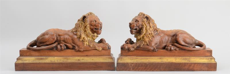 Appraisal: PAIR OF CONTINENTAL CARVED AND PARCEL-GILT WALNUT FIGURES OF RECUMBENT