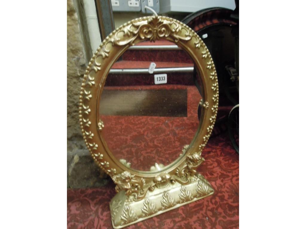 Appraisal: Three Edwardian mahogany wall mirrors of oval form with moulded