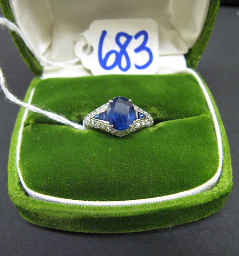 Appraisal: SAPPHIRE DIAMOND AND EIGHTEEN KARAT WHITE GOLD RING centered and