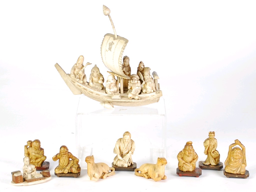 Appraisal: JAPANESE CARVED SECTIONAL IVORY 'BOAT OF HAPPINESS' together with TWO