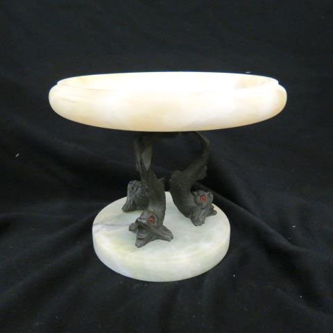 Appraisal: Art Deco Compote a trio of bronzed dolphins onyx top