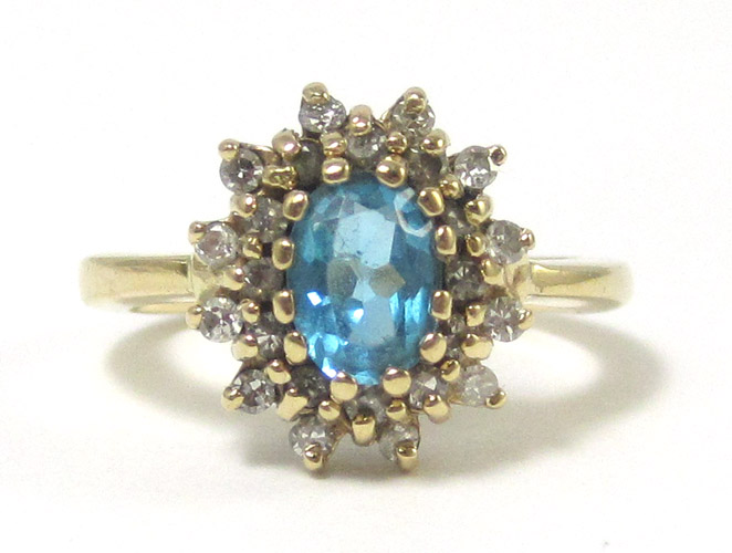 Appraisal: BLUE TOPAZ AND DIAMOND RING k yellow gold having round-cut