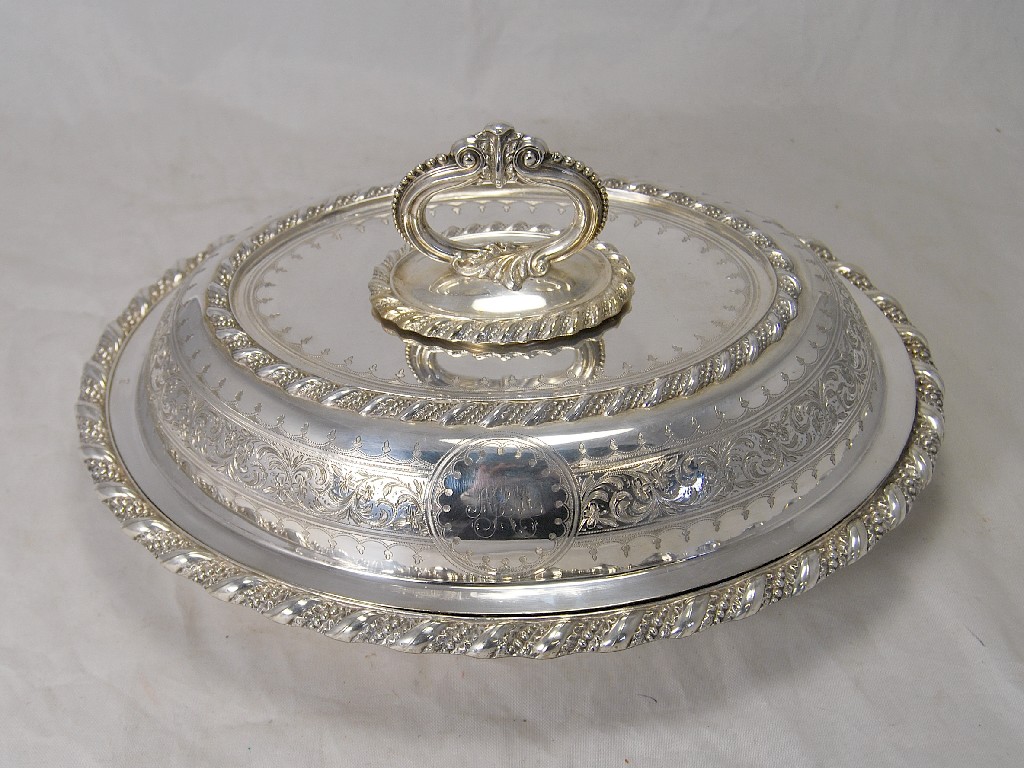 Appraisal: A pair of silver plated entree dishes covers cast and