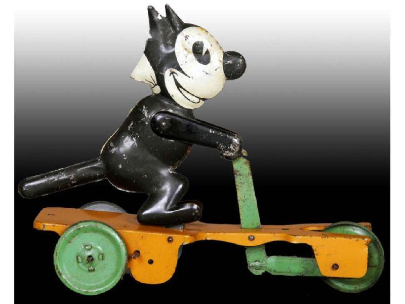 Appraisal: Chein Tin Wind-Up Felix the Cat Scooter Toy Description ''