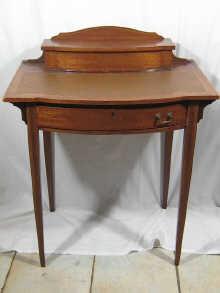 Appraisal: An Edwardian lady's inlaid mahogany writing desk with bow front