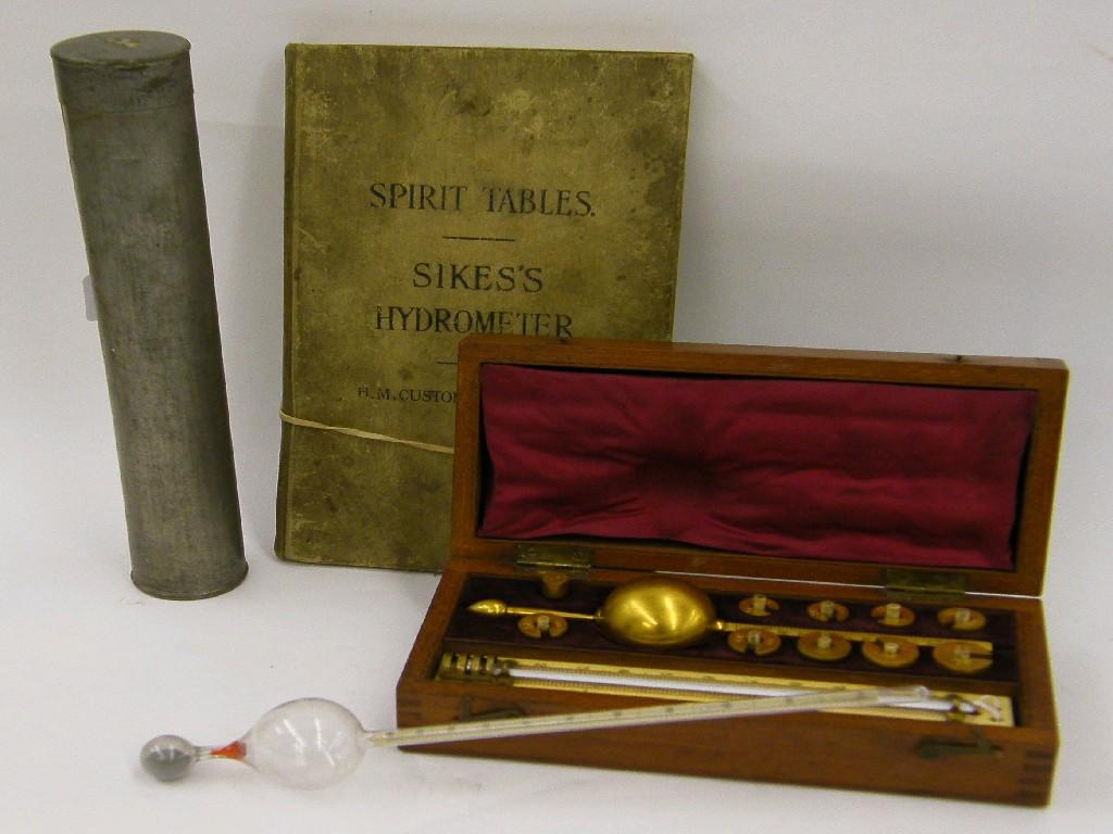 Appraisal: Sykes hydrometer in a boxwood inlaid mahogany case wide with