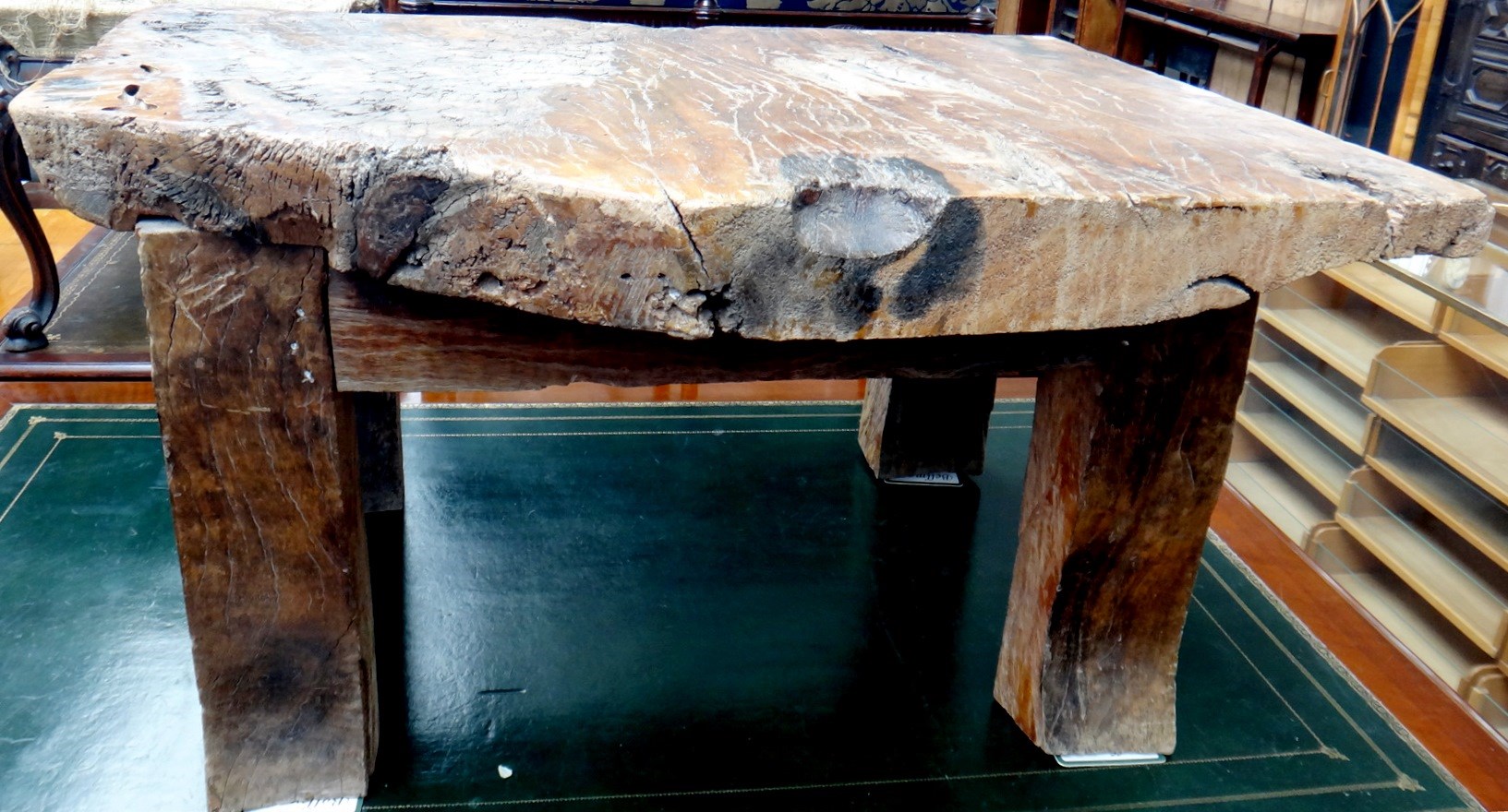 Appraisal: A th century African hardwood coffee table of slab construction