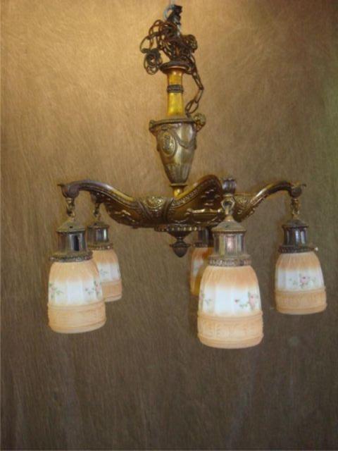 Appraisal: Bronze chandelier with glass shades Has rams heads on sides