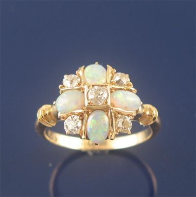 Appraisal: A Edwardian opal and diamond cluster ring set with four