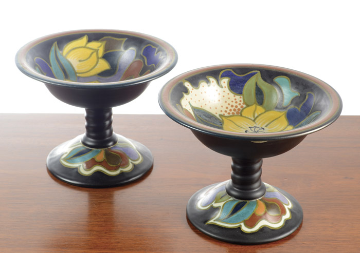 Appraisal: PAIR GOUDA CERAMIC COMPOTES Art Nouveau floral design on black