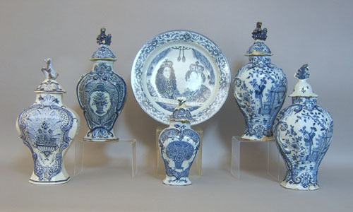 Appraisal: Five Delft garnitures together with a charger th th c