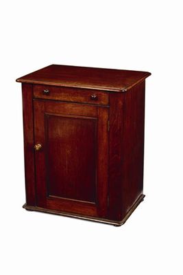 Appraisal: A mahogany cupboard the moulded edge top now hinged above