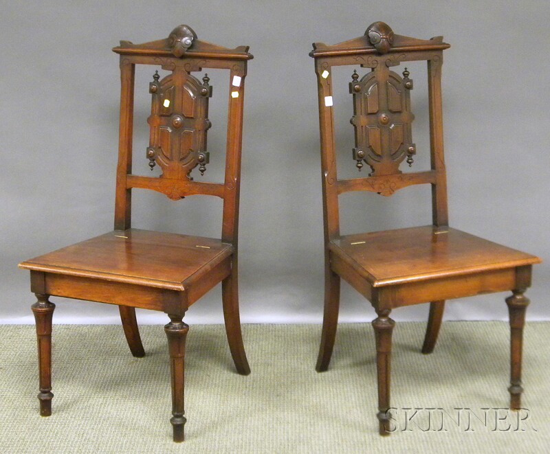 Appraisal: Pair of Victorian Renaissance Revival Carved Walnut Lift-seat Hall Chairs