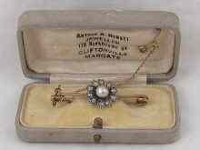 Appraisal: An Edwardian diamond and pearl brooch set in yellow metal