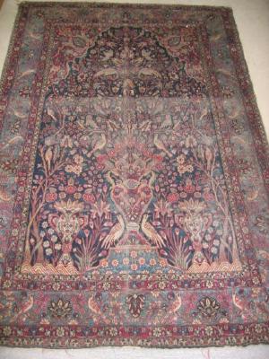 Appraisal: A PERSIAN RUG early th century the navy blue field