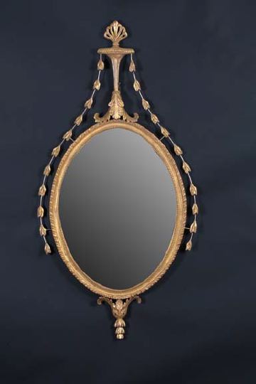 Appraisal: English Carved Giltwood Oval Looking Glass in the style of