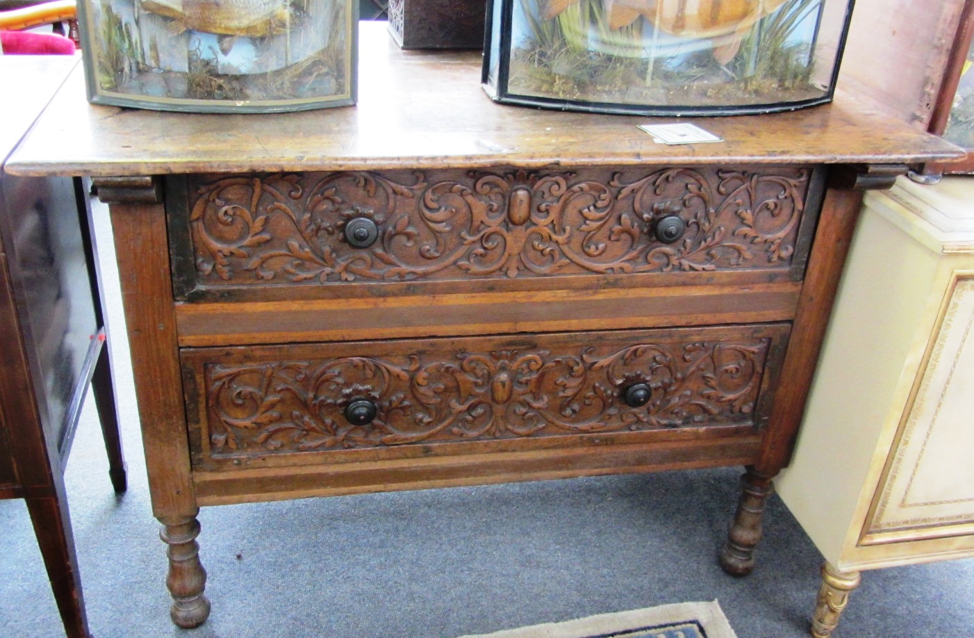 Appraisal: A th century cocobolo wood chest of two carved drawers