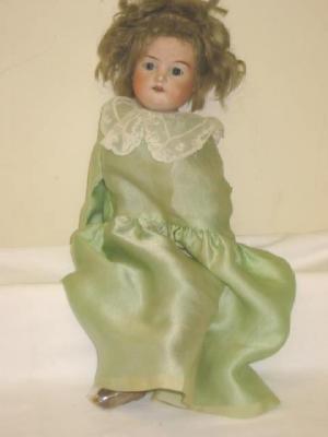 Appraisal: An Armand Marseille bisque shoulder head girl doll with fixed