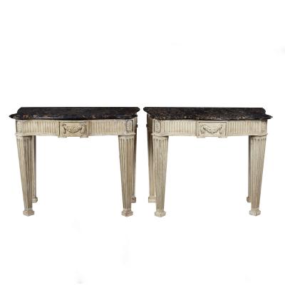 Appraisal: A pair of painted console tables with Portor marble tops