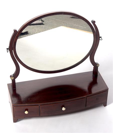 Appraisal: A Regency mahogany dressing mirror the oval framed mirror plate