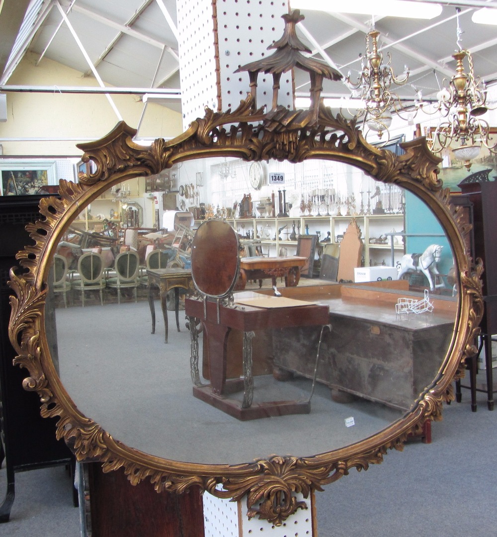 Appraisal: A th century style carved gilt framed oval wall mirror