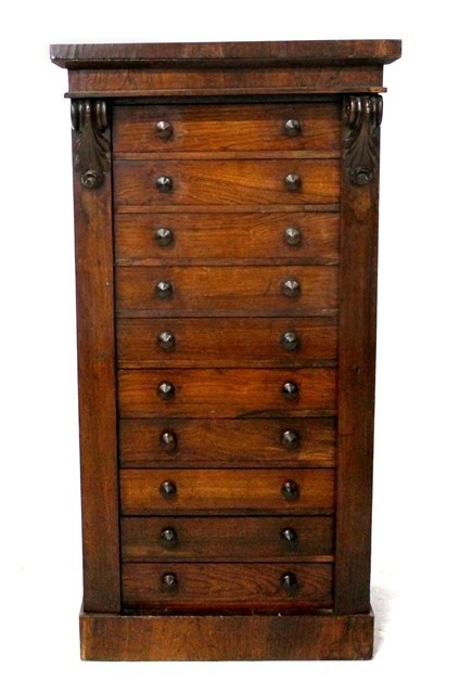 Appraisal: A Victorian rosewood Wellington chest the side locking bar enclosing