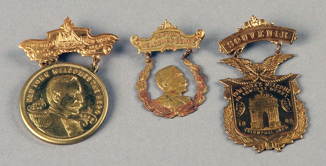 Appraisal: brass badges New York's welcome to Admiral Dewey September