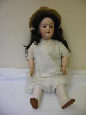 Appraisal: A large French bebe bisque headed doll with fixed brown